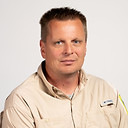 A portrait of a man wearing a khaki colored shirt, he is Gary Vonderhoe, a fish biologist in Oregon
