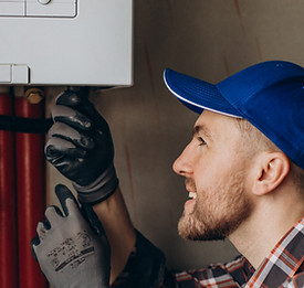 service-man-adjusting-house-heating-system.jpg