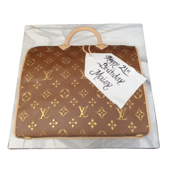 Luxurious Louis Vuitton handbag themed cake with intricate 2D design, perfect for fashion enthusiasts and special occasions.