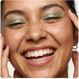 Woman with green eyeshadow from an online cosmetics store