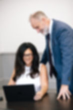 Adam Flohm and Nadine Kahlon reviewing property details on a tablet