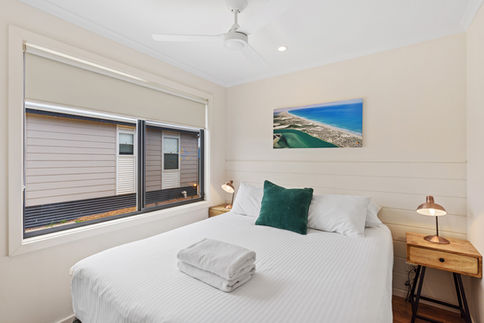 Cozy cabin bedroom with beach view