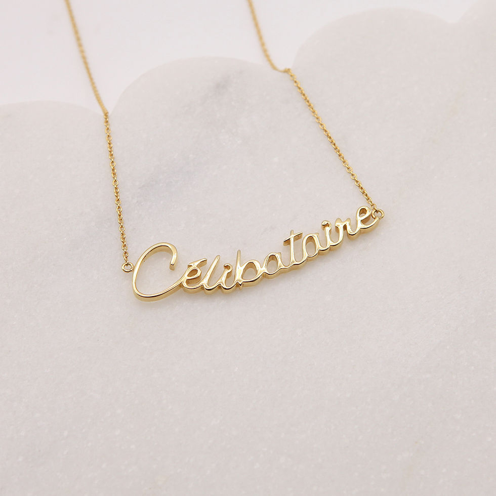 Gold Celibataire necklace on white background, jewelry product photography, The Single Edit