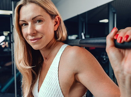 Woman strength training as part of a menopause exercise program