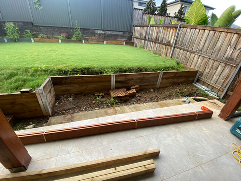 backyard area with timber stairs and alfresco area before photo