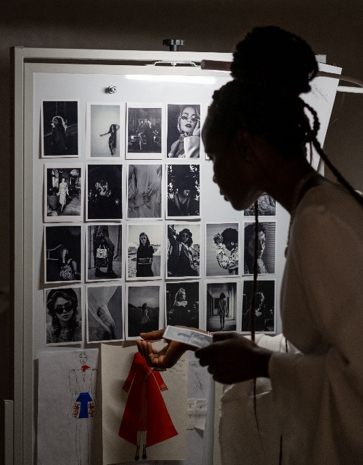 A young woman curating a photo portfolio