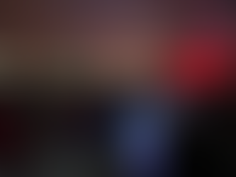 DJ mixing live in front of large dance floor crowd for corporate event 