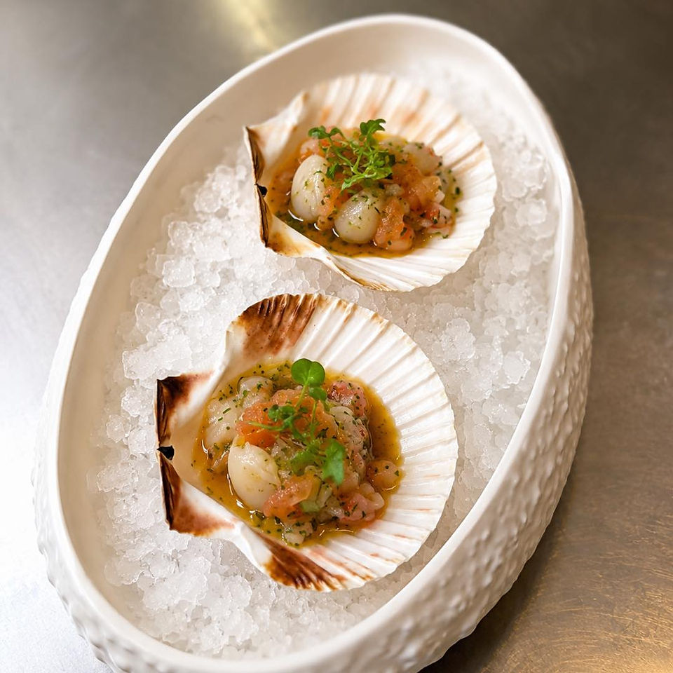 resh from the sea, finished with a tropical twist. Scallops, prawns, tomato, onion, celery, and pass