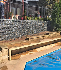 Feature and retaining wall to a pool area