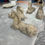 Thumbnail: Four Vintage Cast Stone Recumbent Horse Garden Statues.