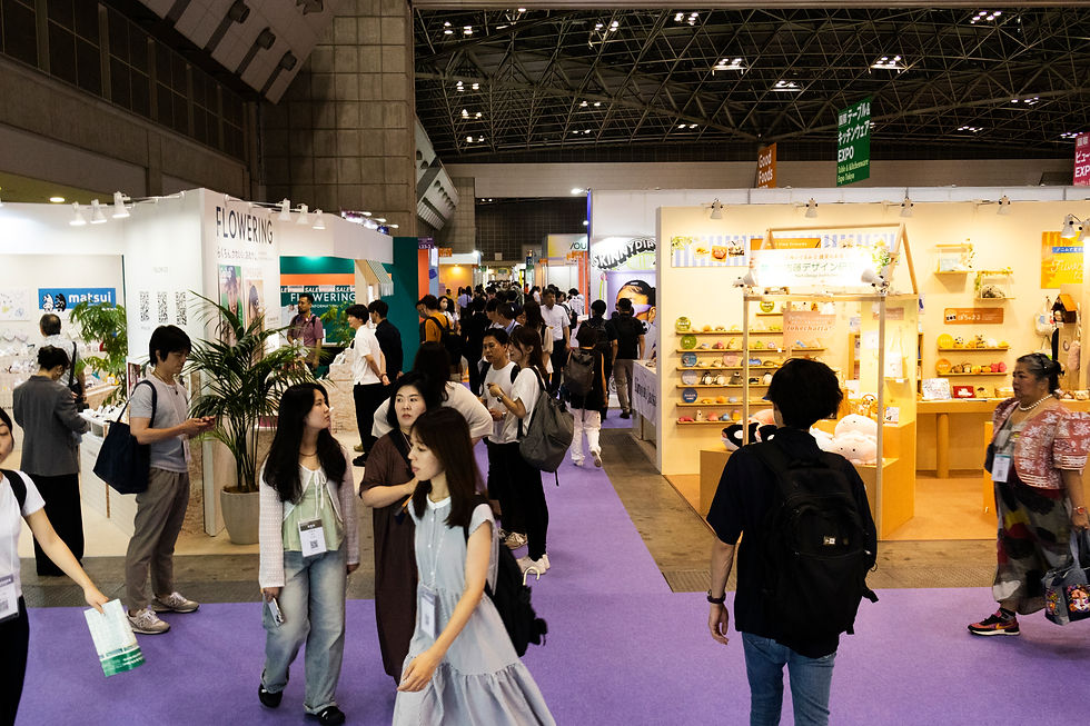 Attendees Walking Through A Busy Trade Show Exhibition Hall With Vendor Booths