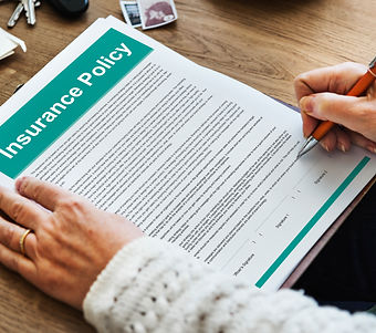 Person Signing a Health Insurance Policy Agreement Form