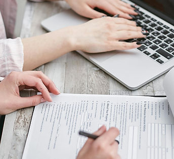 A Person Typing on Laptop