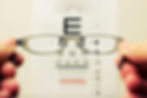 Person Holding Eyeglasses