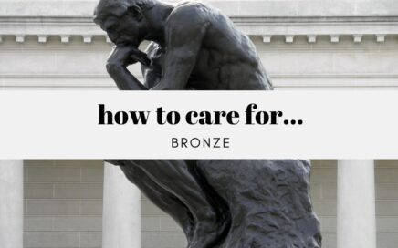 Bronze Sculpture Of A Seated Thinking Figure With A Banner Reading How To Care For Bronze