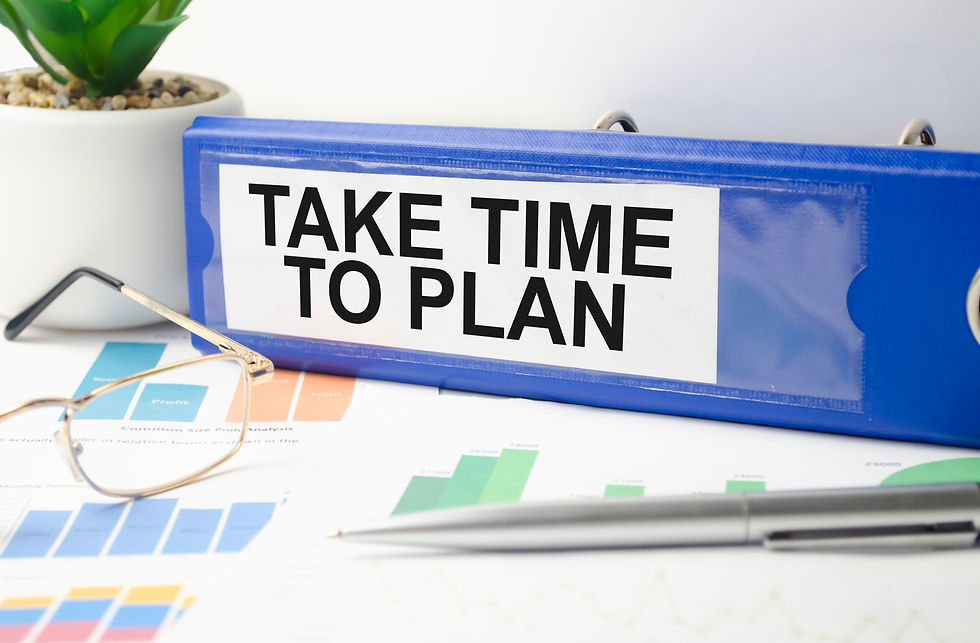 Blue Binder Labeled "Take Time To Plan" On A Desk With Financial Charts, Eyeglasses, And A Pen, Representing Financial Planning, Retirement Preparation, Insurance Strategy, Wealth Management, Budgeting, And Long Term Financial Goals