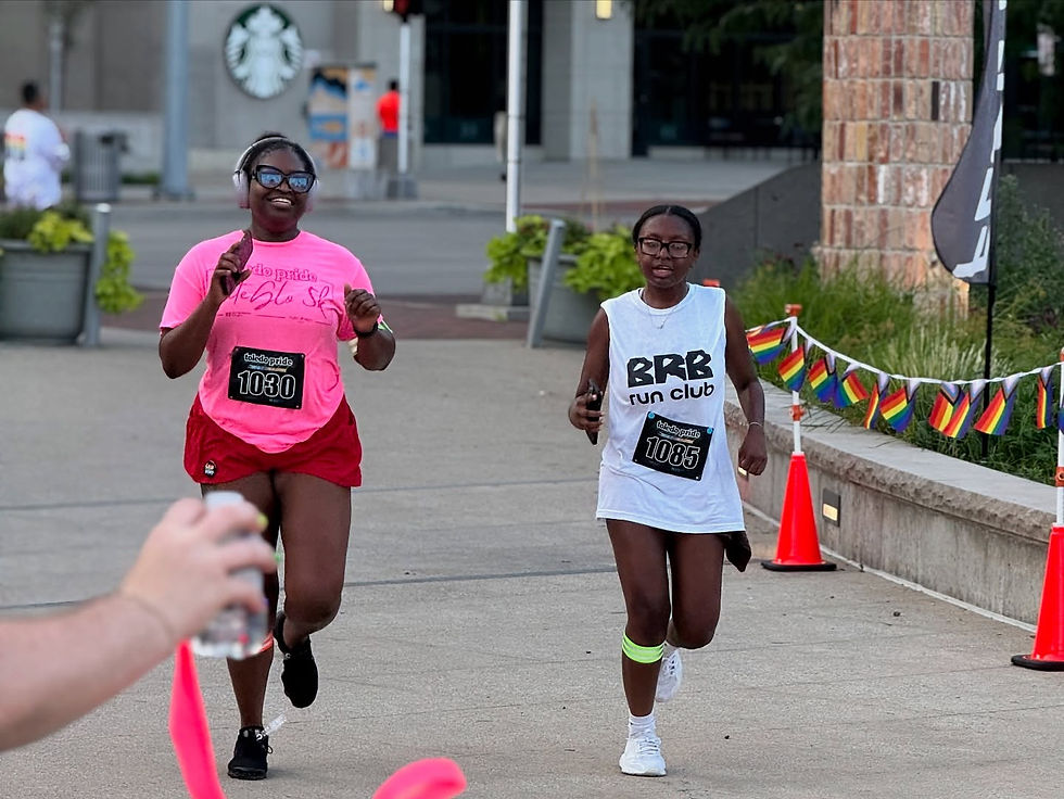 Two sister completing the Toledo Pride Nite Glo 5K.