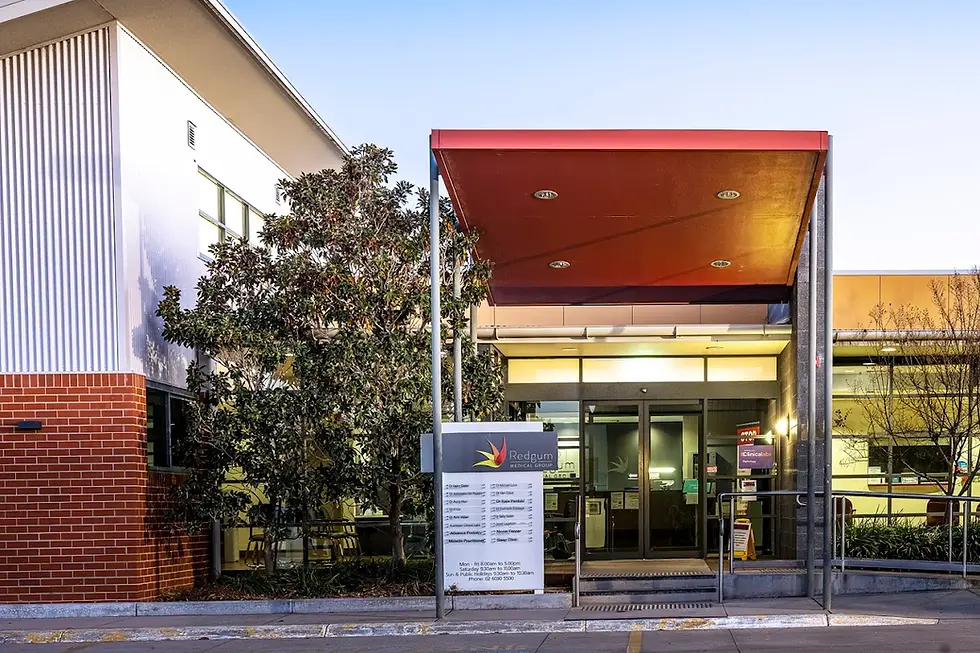 Exterior view of a modern building with sign showing different services offered