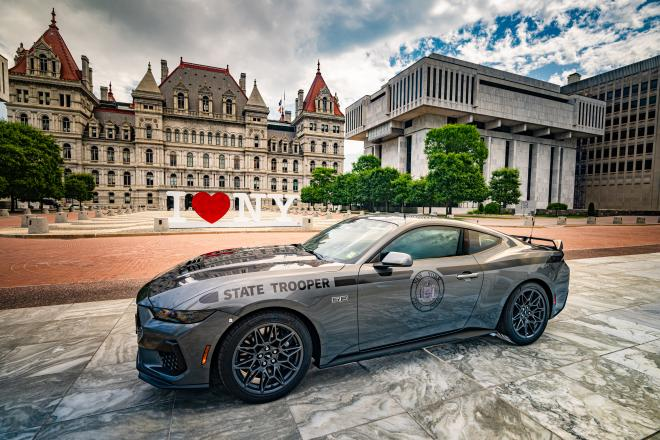2025 Mustang GT patrol vehicle photographed at the Empire State Plaza in Albany, in front of the iconic I Love NY sign, with the State Capitol as a backdrop.
