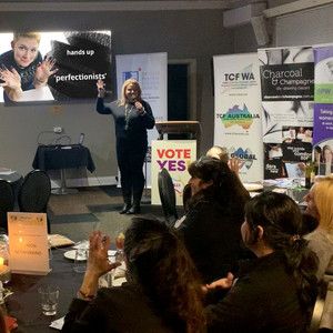 Creativity Coach Aneta Wnek asking for a show of hands who in the audience considers themselves a 'perfectionist'