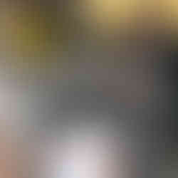 A guest laughing as their portrait is drawn during the event