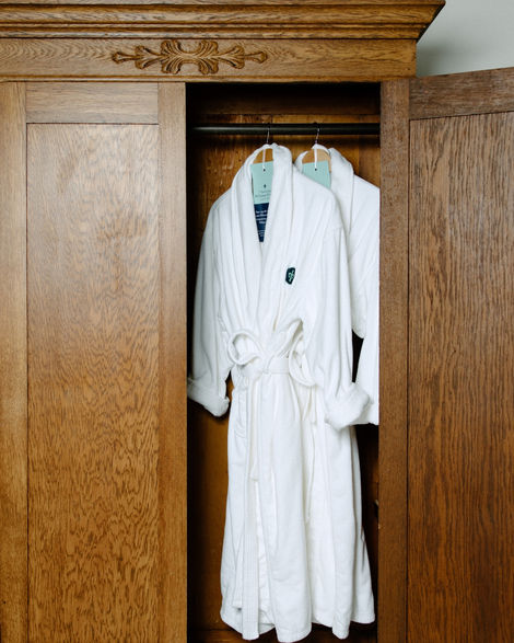The Amelia Island Williams House Robes in a closet