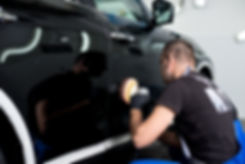 Man Polishing Car