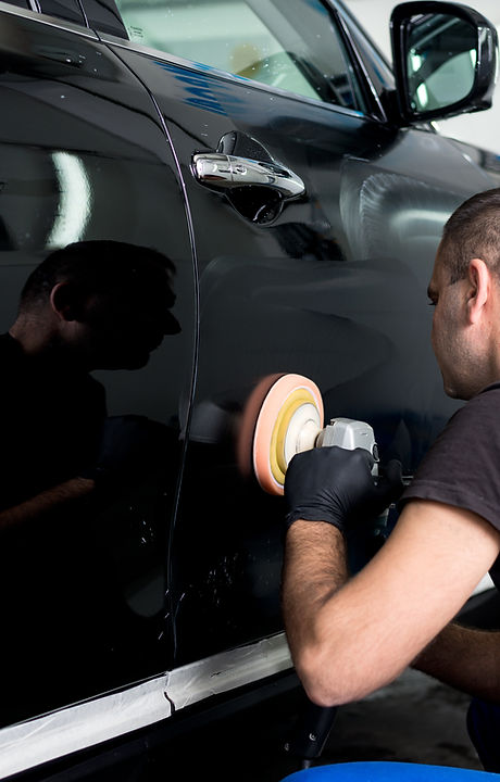 Man Polishing Car