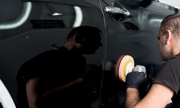 Man Polishing Car