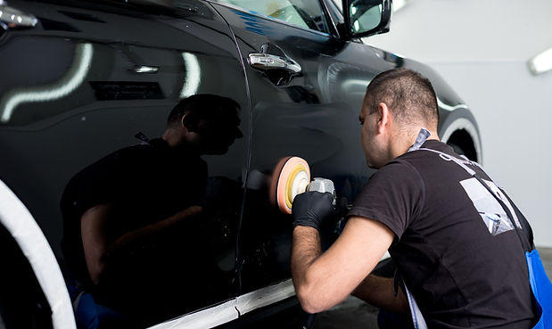 Man Polishing Car