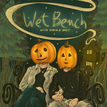 Two lovers sat together on a victorian bench, with a cottage in the background on the right. The cottage is emitting swirling smoke that circulates the words 'Wet Bench' in scribbly hand writing, and 'with Owen & Bret' in Daisy's writing. They are surrounded by pine trees within a night scene. There are pumpkins on their heads with the faces cut out.