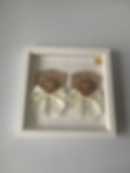 Brown-applique-teddy-bears-with-cream-bows-in-a-white-frame-front-view