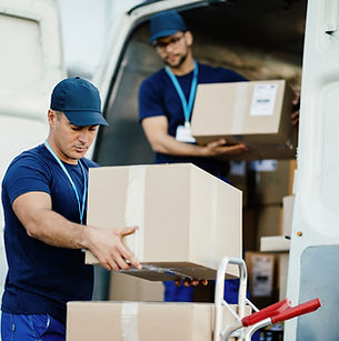young-courier-his-colleague-unloading-cardboard-boxes-from-delivery-van.jpg
