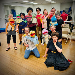 The cast and team of the Felt Menagerie with puppets by Kenneth Thompson.