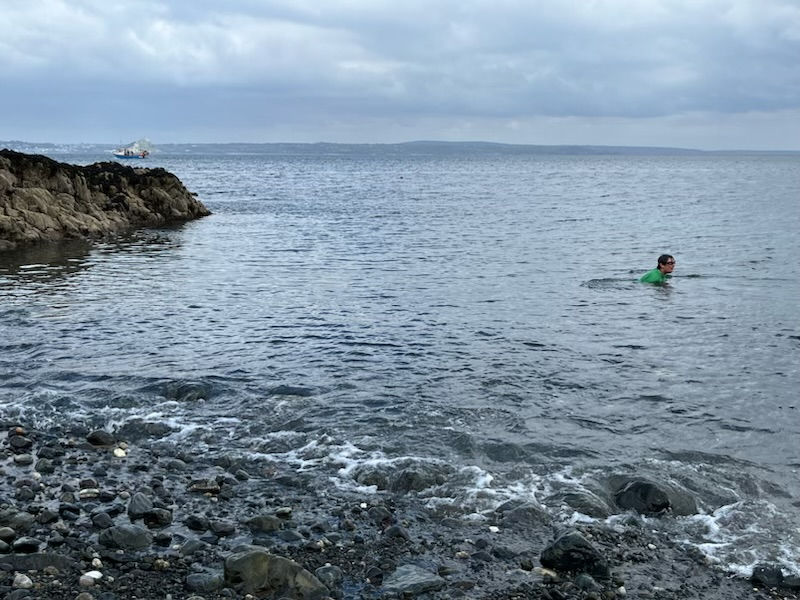 Karen taking a swim in the cold sea at Cornwall