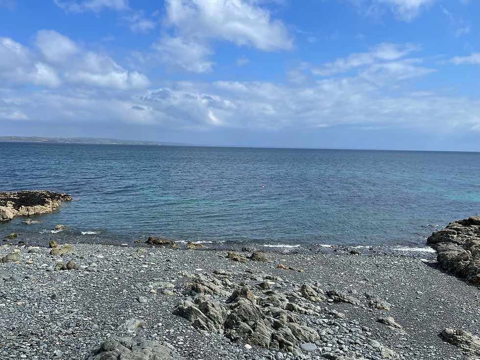 Sea view from a rocky beach near the Cornwall coastal path.