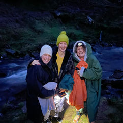Having an evening dip with friends below Pen Y Fan 