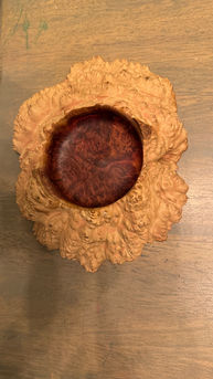 Textured wooden bowl with smooth dark interior