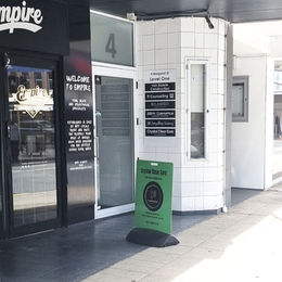 Street view of Crystal clear ears clinic with signs