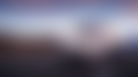 White semi-truck driving on the road