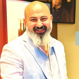 DJ Beeno performing live set with modern DJ equipment at Chicago event