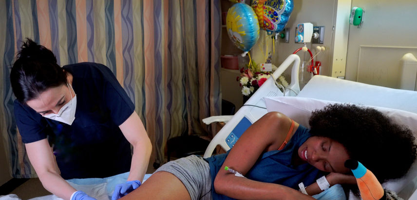 Lindsay with Patient.Still002.jpg