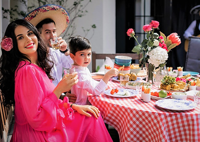 Happy family enjoying eating at a restaurant in europe