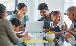 learning-education-big-family-table-with-laptop-home-with-kids-studying-parents-streaming-