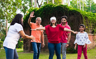 indian-family-playing-blindfold-andhali-koshimbir-game-park-garden-multi-generation-asian-