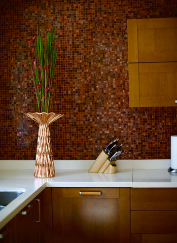 Copper mosaic backsplash, flowers, and knives