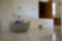 Silver Basket for towels decorating a bathroom