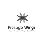 Logo de Prestige Wings – Cliente de la agencia de publicidad Roca3 en Costa Rica