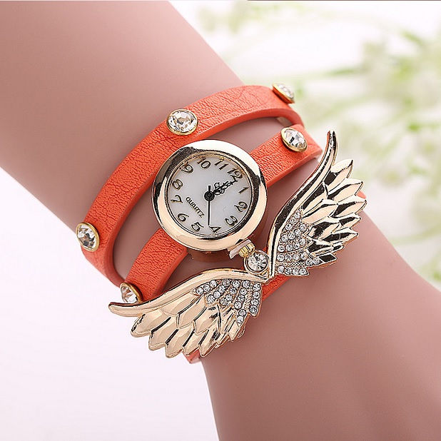 Miniatura: Reloj con alas doradas