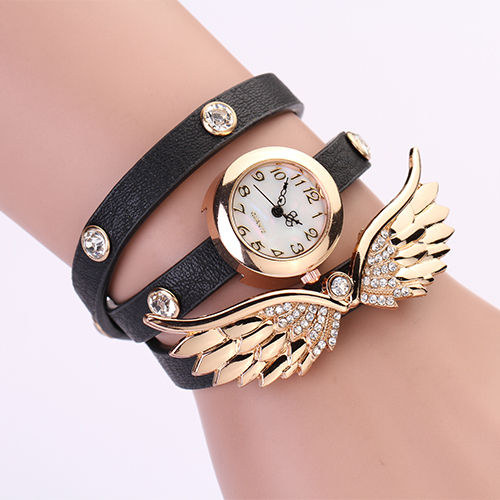 Miniatura: Reloj con alas doradas